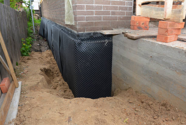 Happy homeowners after waterproofing job in Douglas